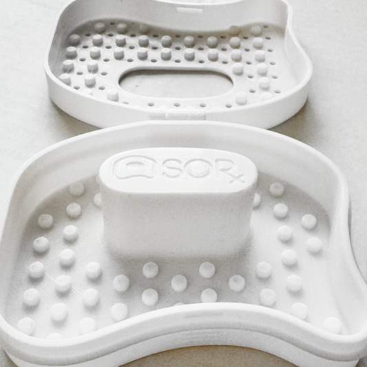 Close-up view of the SORxCASE, designed with airflow vents and textured grips to protect and store your SORSOAP securely.